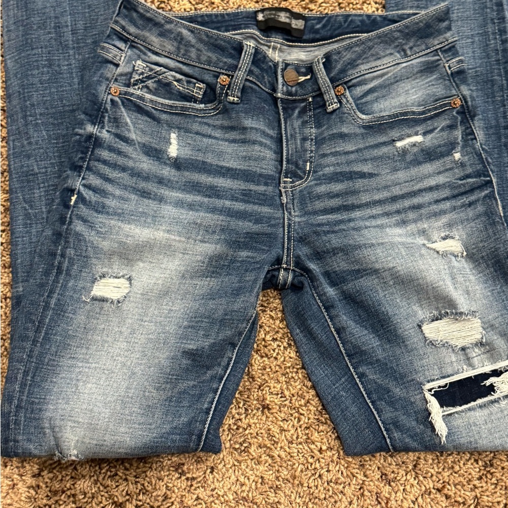 Buckle Blue Skinny Jeans with Distressed Details